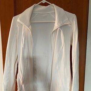 White, fitted lululemon zip-up sweatshirt.